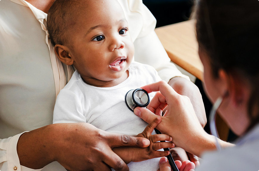 pediatrician checking child using stethoscope