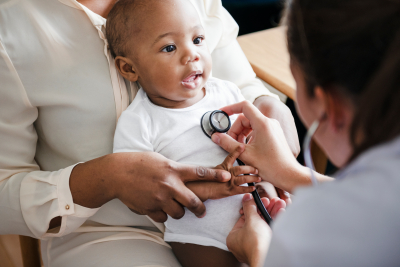 doctor examining the baby