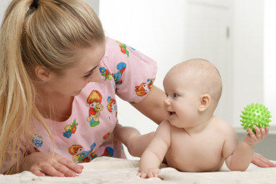 pediatrician massaging a baby