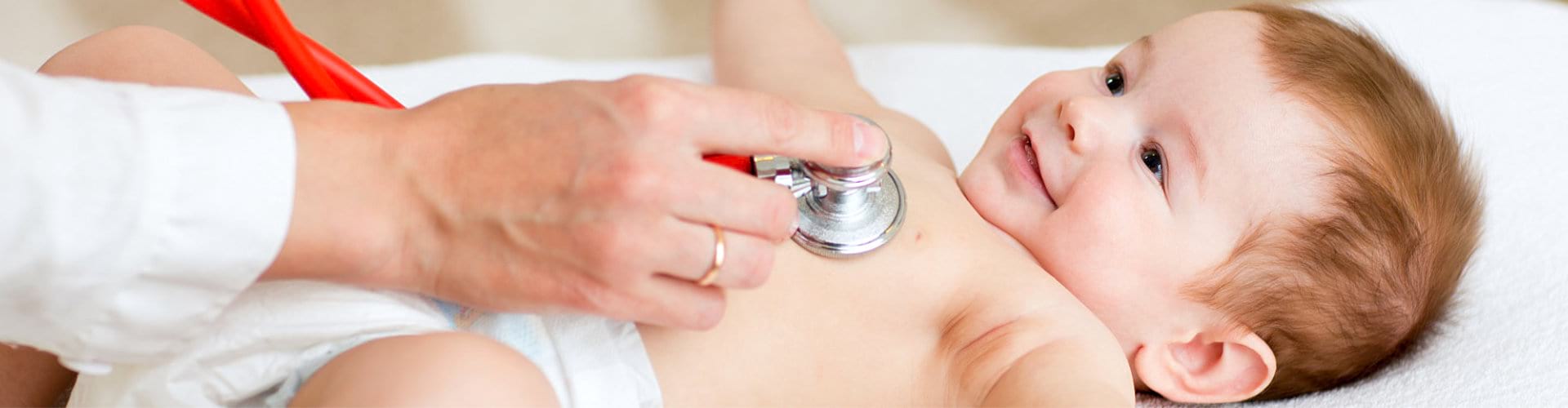 pediatrician checking little child using stethoscope