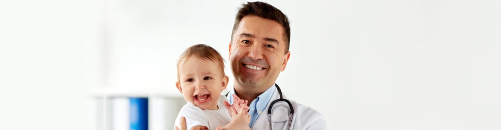 doctor carrying little child