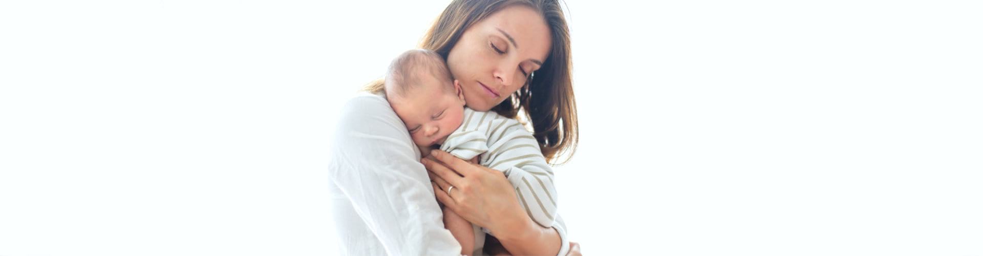 woman carrying little child